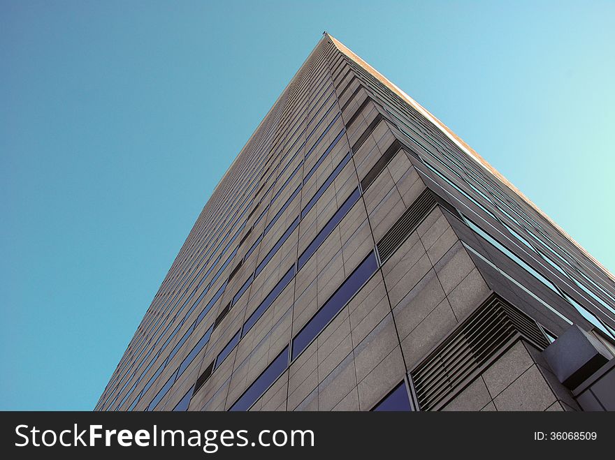 Tokyo office building under clear blue sky. Tokyo office building under clear blue sky.