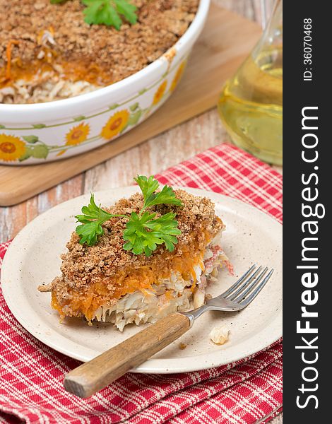 Gratin with fish and pumpkin on the plate