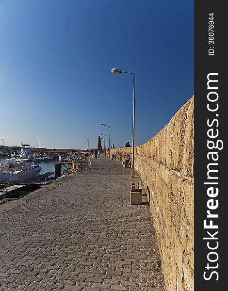 Cyprus Seaside at afternoon with boats and people around