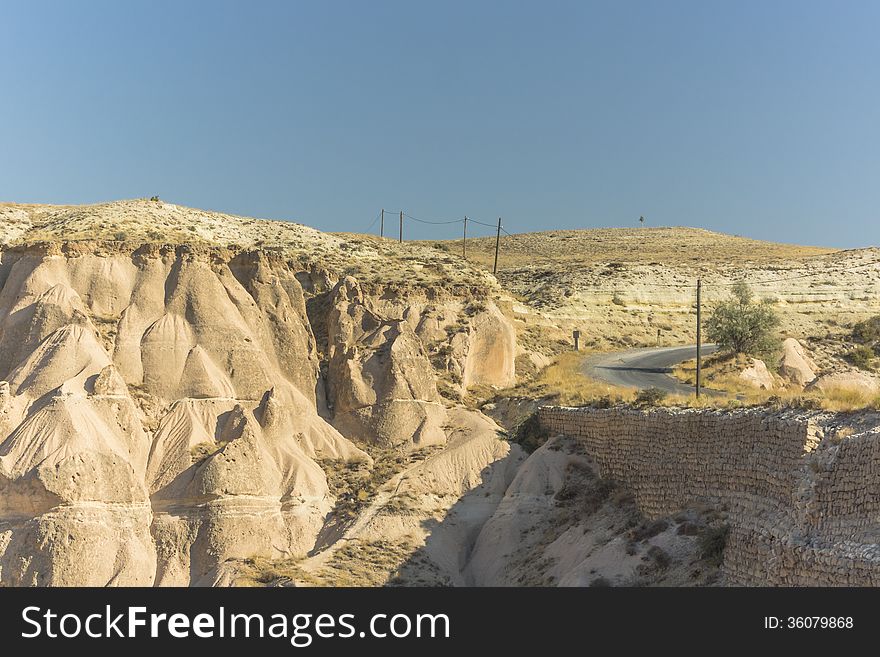 Warm Glow of Sunset on the Fairy Chimneys of Cappadocia, Popular Travel Destination in Central Turkey. Warm Glow of Sunset on the Fairy Chimneys of Cappadocia, Popular Travel Destination in Central Turkey