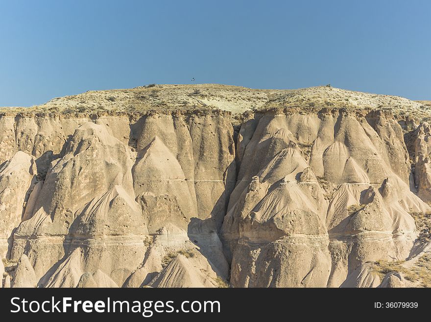 Warm Glow of Sunset on the Fairy Chimneys of Cappadocia, Popular Travel Destination in Central Turkey. Warm Glow of Sunset on the Fairy Chimneys of Cappadocia, Popular Travel Destination in Central Turkey