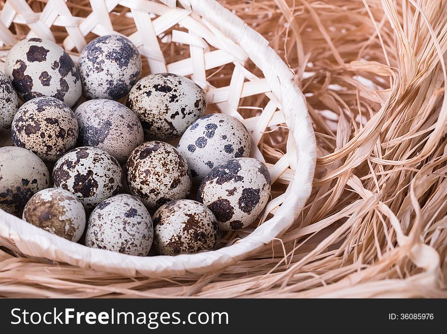 Fresh quail eggs in a basket