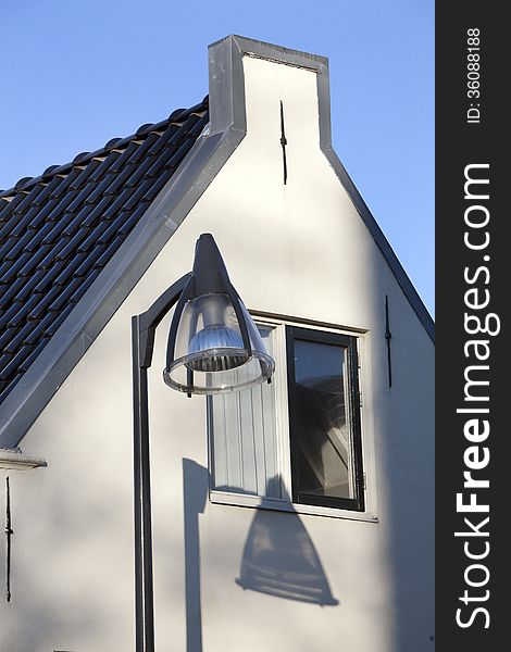 Lamppost and nice shadow on an old house in Vlaardingen, Netherlands