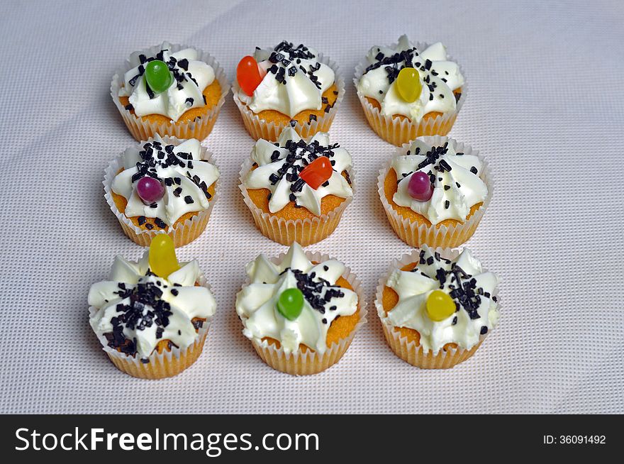 A tasty set of cup cakes with jelly bean decorations. A tasty set of cup cakes with jelly bean decorations