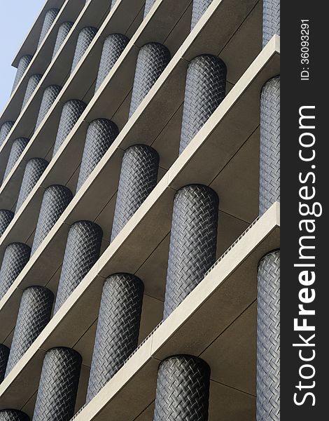 Image taken of a new modern commercial building with black tubes in London, England. Image taken of a new modern commercial building with black tubes in London, England