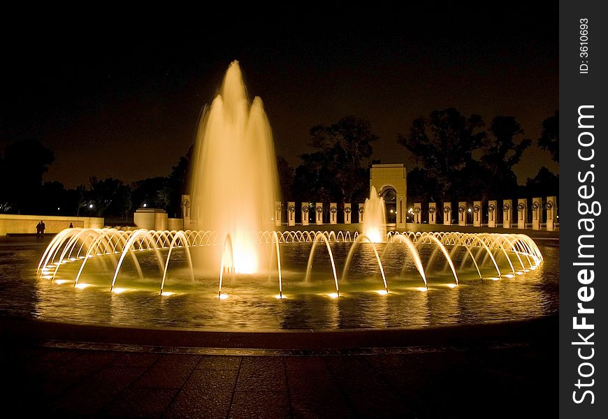 An evening time exposure view of the World War II Memorial and fountain in Washington DC. An evening time exposure view of the World War II Memorial and fountain in Washington DC.