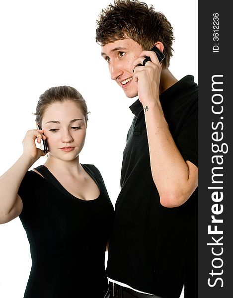 A young couple on the phone together. A young couple on the phone together