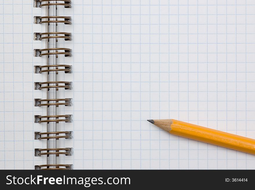 Photo of pencil on a spiral notepad. Photo of pencil on a spiral notepad