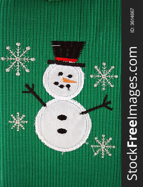 Snowman And Snowflakes On Green Background