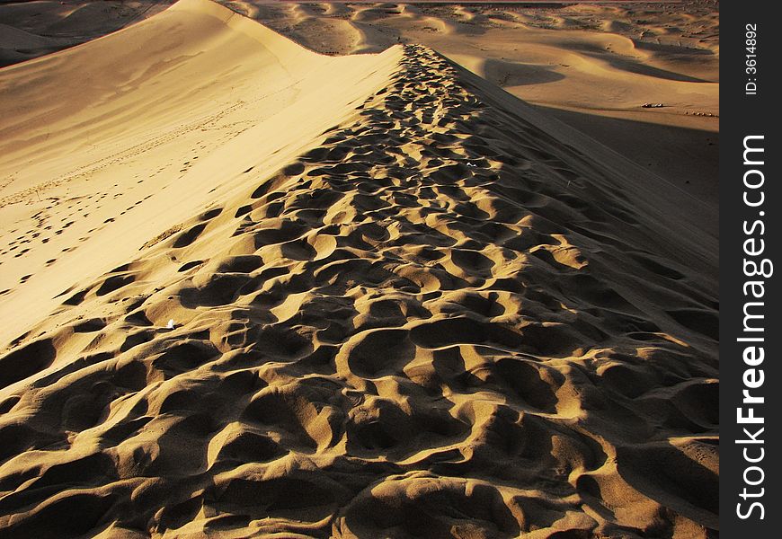 Wide desert has light side and shadow. Wide desert has light side and shadow