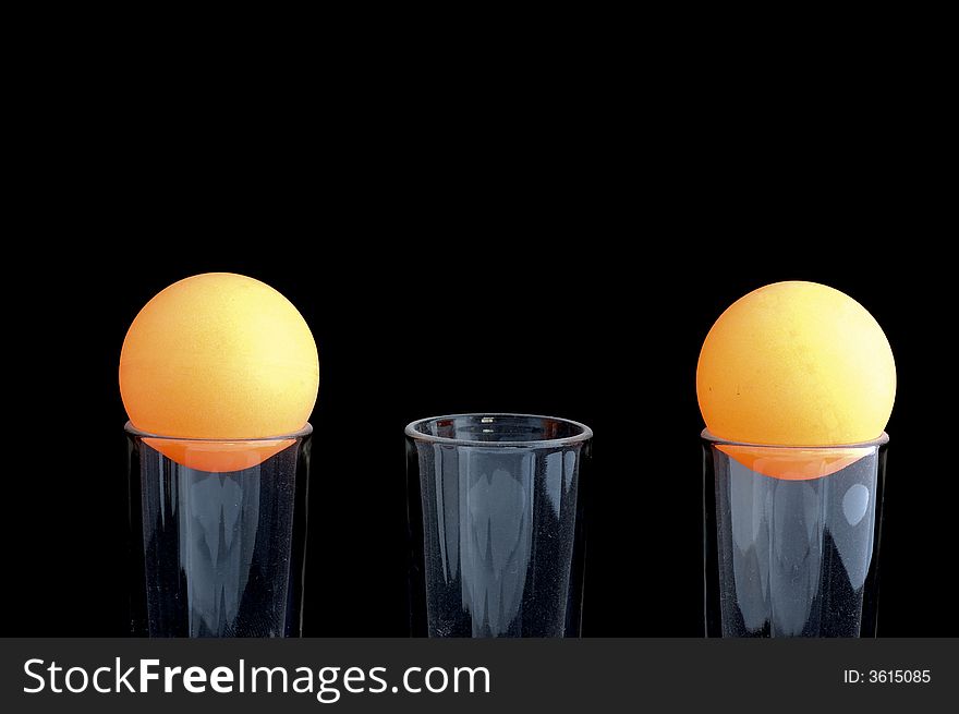 Two orange balls in background black. Two orange balls in background black
