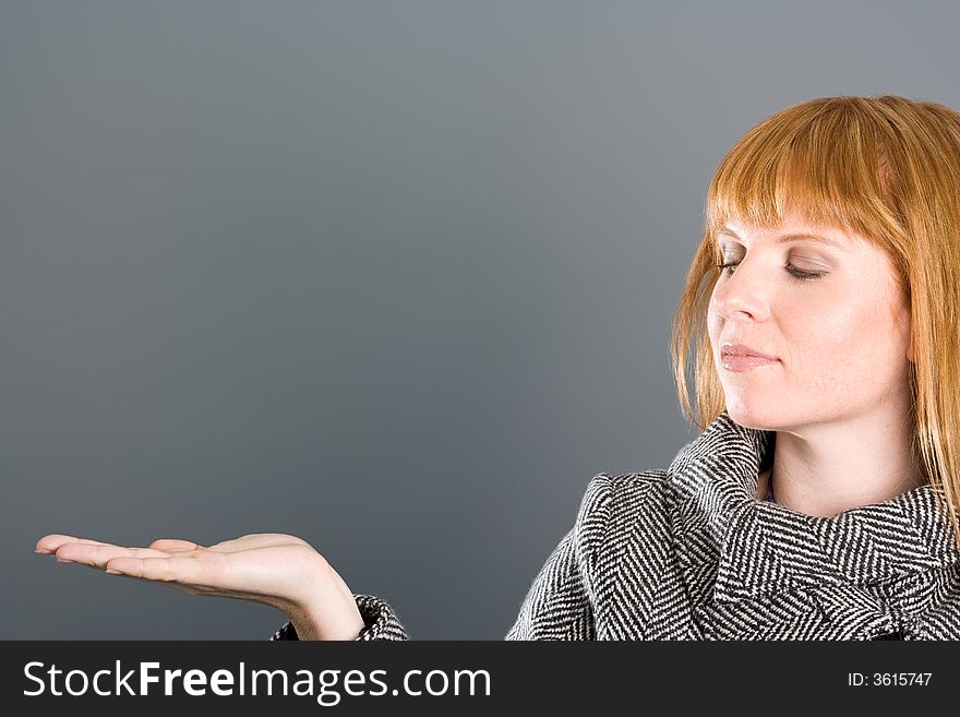 Woman with empty palm to present your ideas. Woman with empty palm to present your ideas.