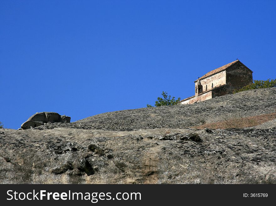 House in the Caucasus mountains with blue sky