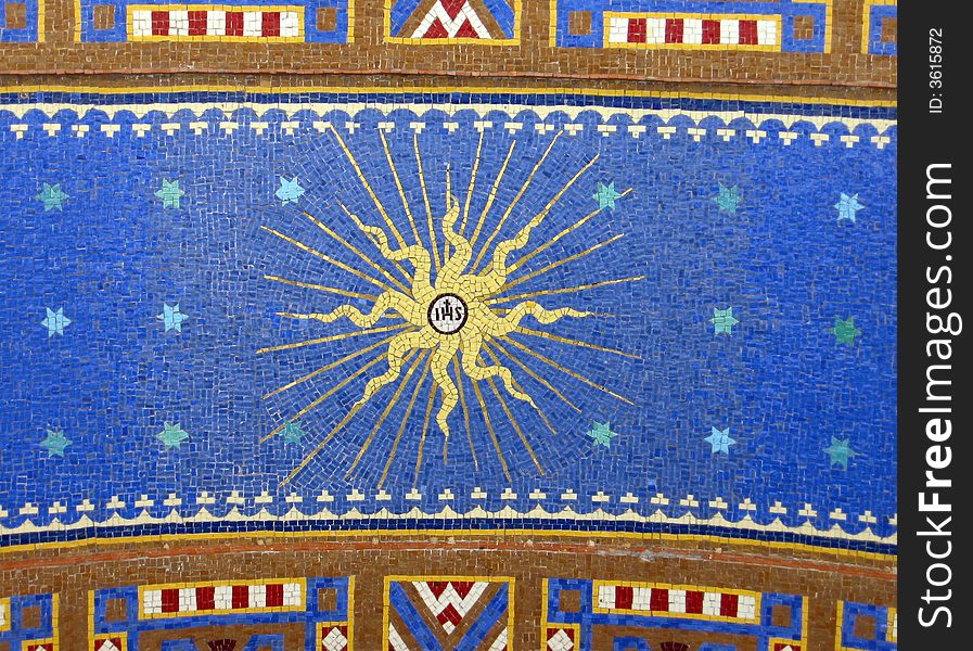 Holy mosaic with a golden star in a blue sky