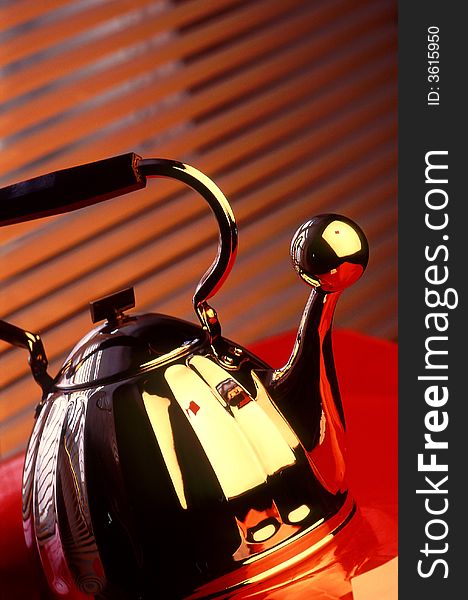 Teapot on a red background