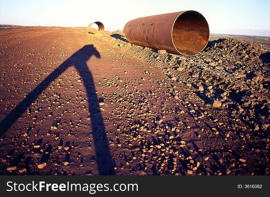 Shadow of the person on a background of a pipe