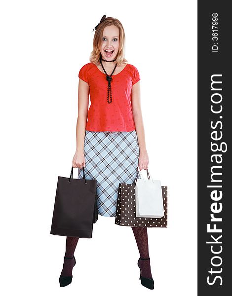 Pretty screaming blond girl with shopping bags in her hands. Pretty screaming blond girl with shopping bags in her hands