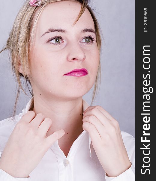 Young confident businesswoman on the grey background. Young confident businesswoman on the grey background