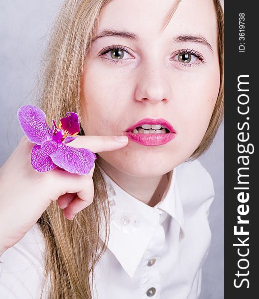 Portrait of beautiful woman with pink orchid. Portrait of beautiful woman with pink orchid