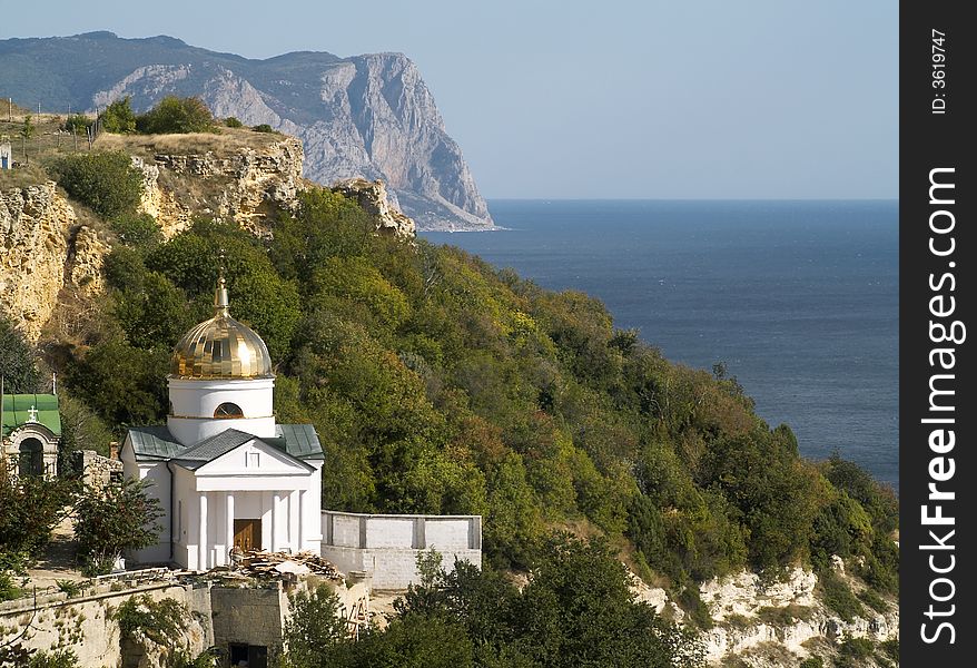 Little orthodox church on a rock at the sea. Little orthodox church on a rock at the sea