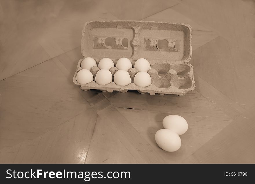 A picture of a container of eggs on table
