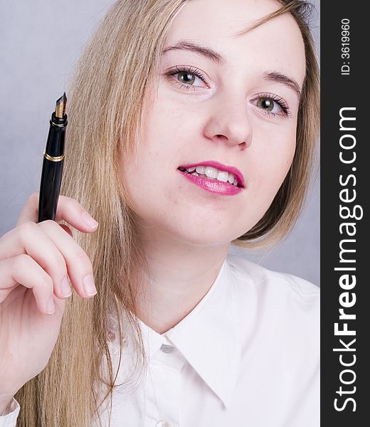 Portrait of beutiful women holding the pen