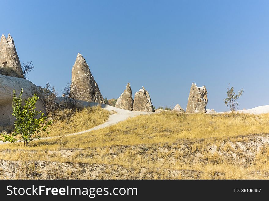 Warm Glow of Sunset on the Fairy Chimneys of Cappadocia, Popular Travel Destination in Central Turkey. Warm Glow of Sunset on the Fairy Chimneys of Cappadocia, Popular Travel Destination in Central Turkey