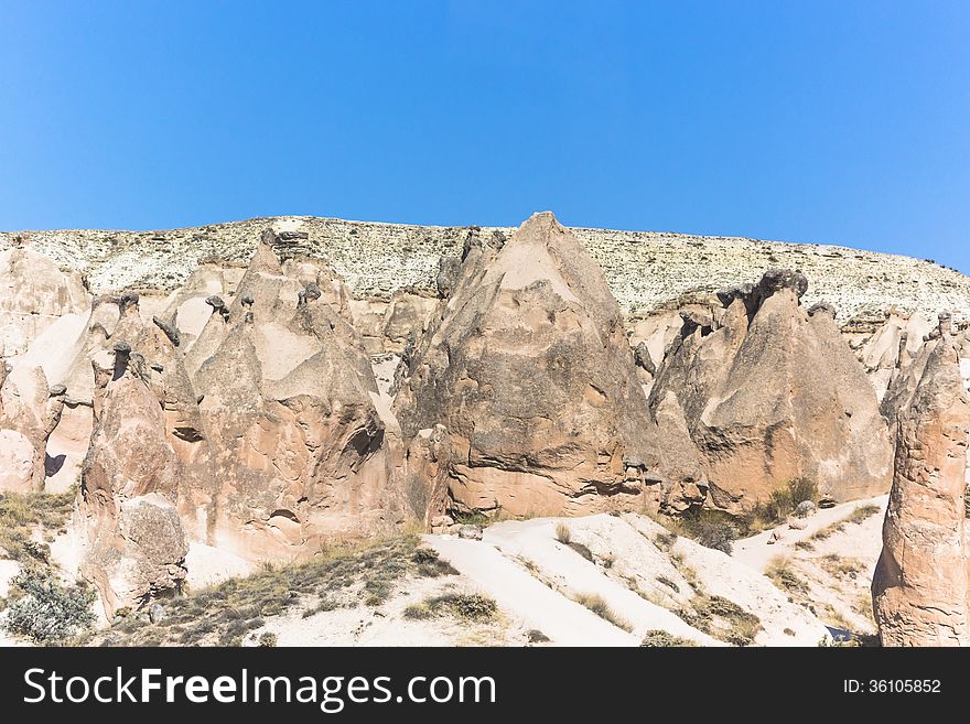 Warm Glow of Sunset on the Fairy Chimneys of Cappadocia, Popular Travel Destination in Central Turkey. Warm Glow of Sunset on the Fairy Chimneys of Cappadocia, Popular Travel Destination in Central Turkey