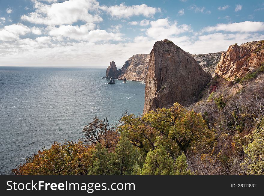 Ukraine, peninsula of Crimea, Sea coast on the Black Sea, large and small pebbles, large boulders, sea waves. Ukraine, peninsula of Crimea, Sea coast on the Black Sea, large and small pebbles, large boulders, sea waves