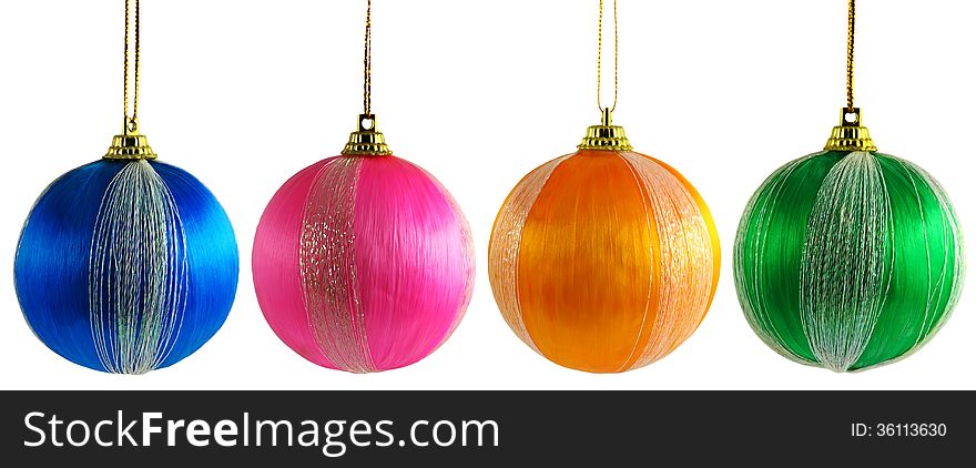 Four multicolored Christmas balls on a white background