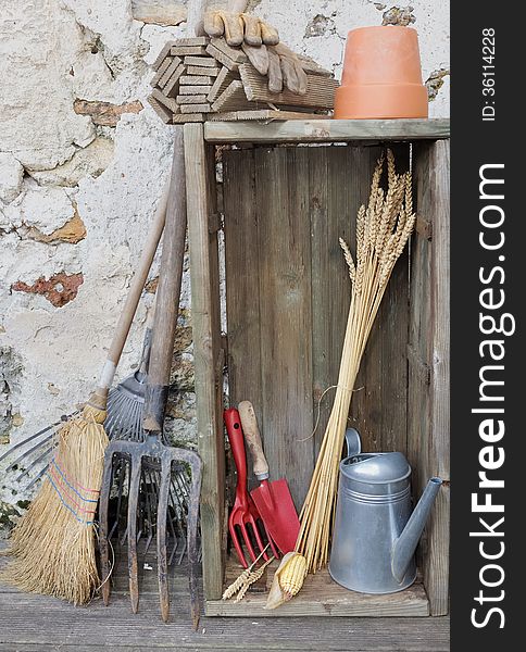 Equipment and gardening tools in a rustic setting. Equipment and gardening tools in a rustic setting