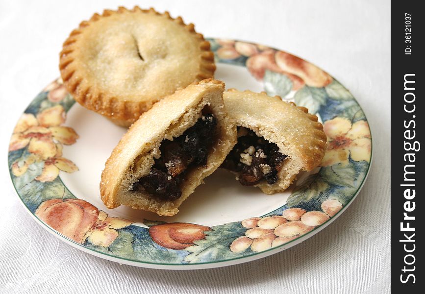 A plate of two Christmas mince pie. A plate of two Christmas mince pie