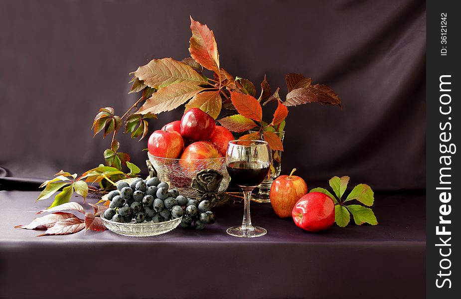 Autumn fruit and a glass of wine. Autumn fruit and a glass of wine