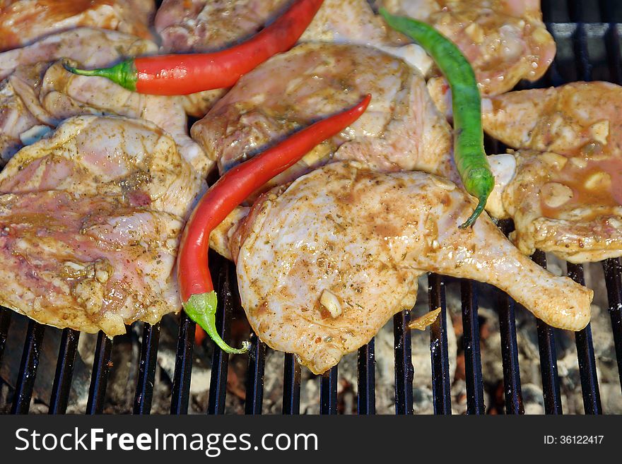 Grilled Chicken Legs And Vegetables In BBQ Cast Iron Grill