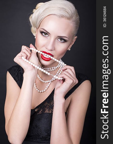 girl with blond hair with pearls. girl with blond hair with pearls