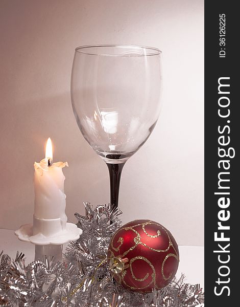 Christmas toy, candle and glass. Christmas toy, candle and glass