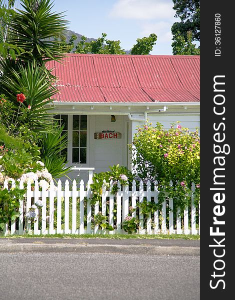 Classic New Zealand holiday bach on the Coromandel Peninsula, NZ - travel and tourism. Classic New Zealand holiday bach on the Coromandel Peninsula, NZ - travel and tourism.