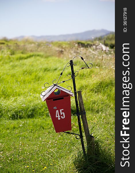 Bright red letter box - NZ farming image.