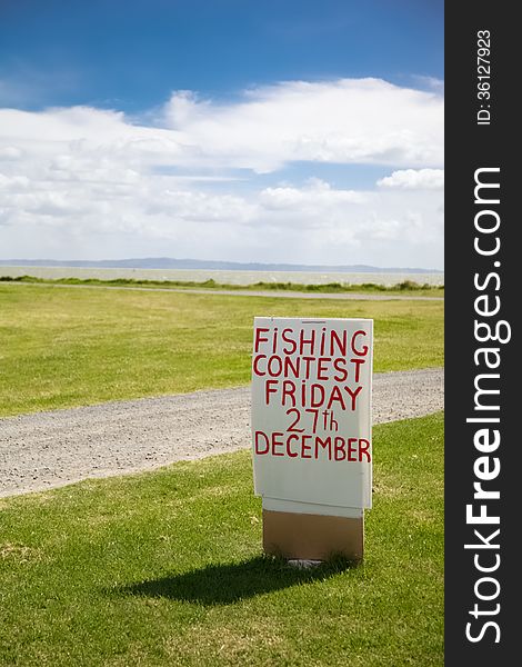 Fishing sign on the Coromandel Peninsula, New Zealand - travel and tourism.