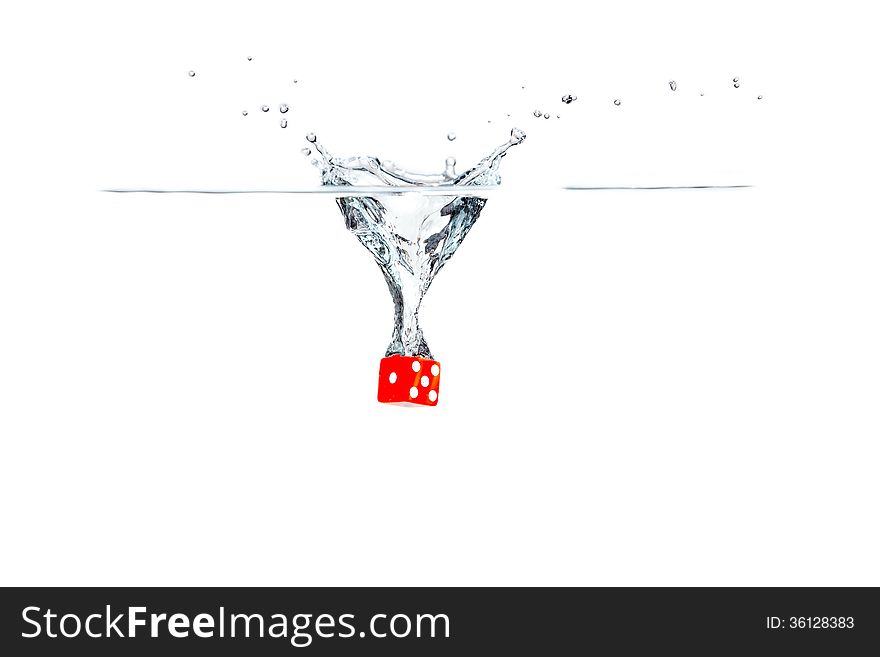Red dice falling into the water. Red dice falling into the water