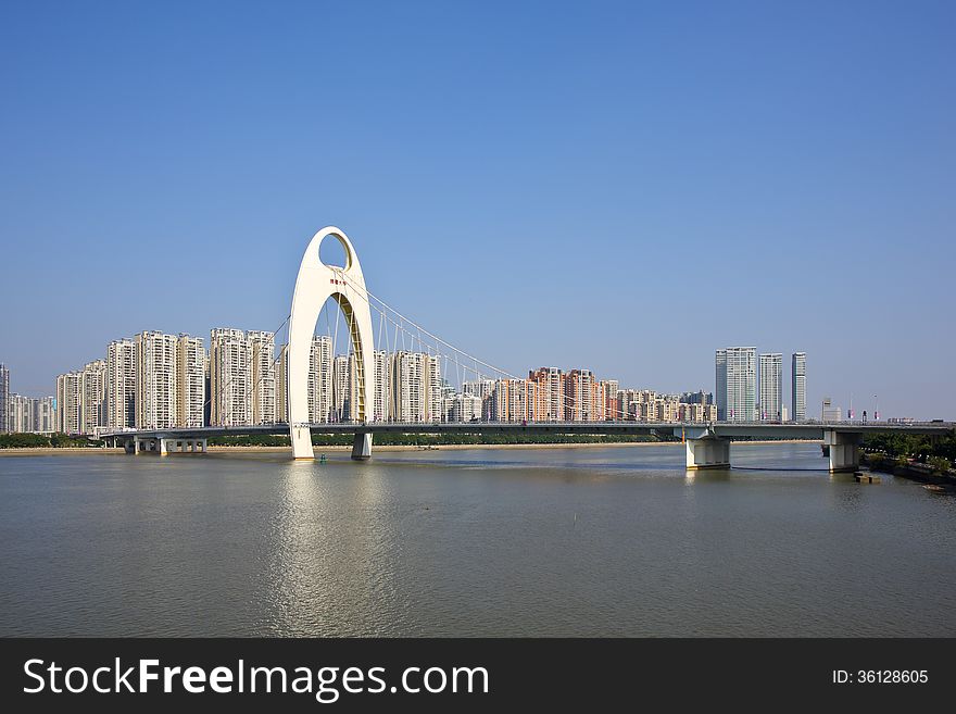 The Liede bridge over the pearl river in blue sky background, Guangzhou of China.