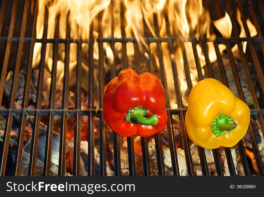 Colorful Bell peppers on the hot BBQ cast iron grill. Colorful Bell peppers on the hot BBQ cast iron grill