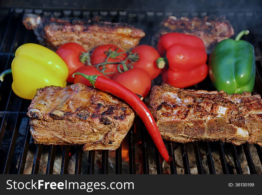 Pork Ribs, brisket, belly roasted in BBQ with vegetables. Pork Ribs, brisket, belly roasted in BBQ with vegetables