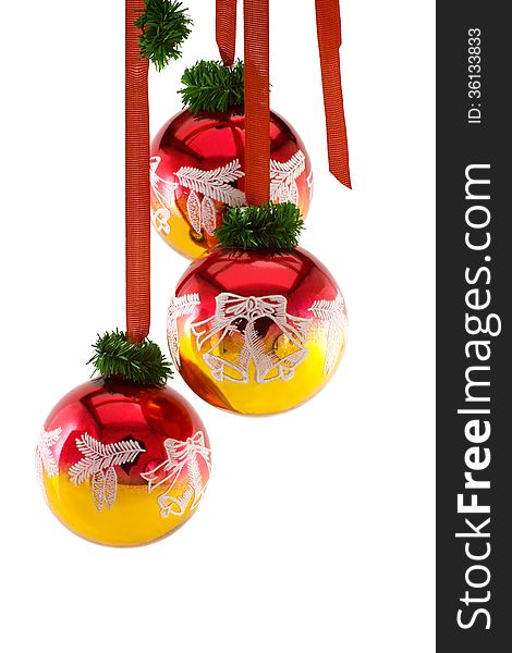 Christmas balls hanging on ribbon isolated on white