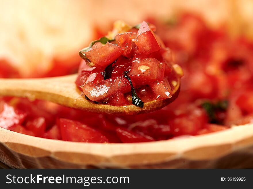 Freshly Sliced And Diced Tomatoes In A Wooden Bowl