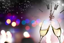 Glasses With Champagne Against Fireworks And Clock Stock Photography Glasses With Champagne Against Fireworks And Clock Stock Photography