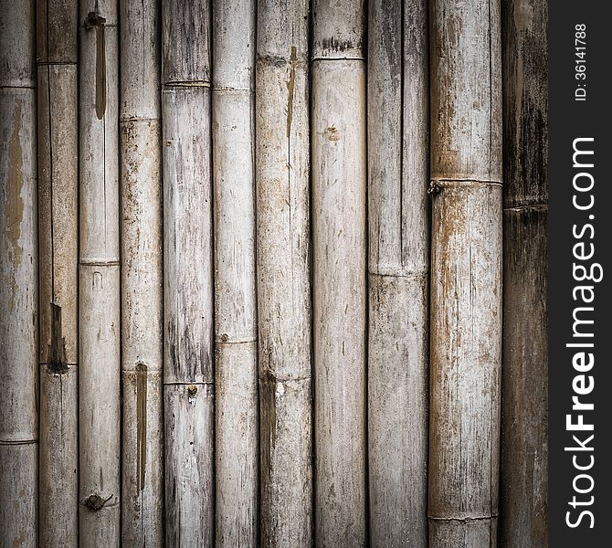 Background of grunge bamboo fence is arranged in vertical