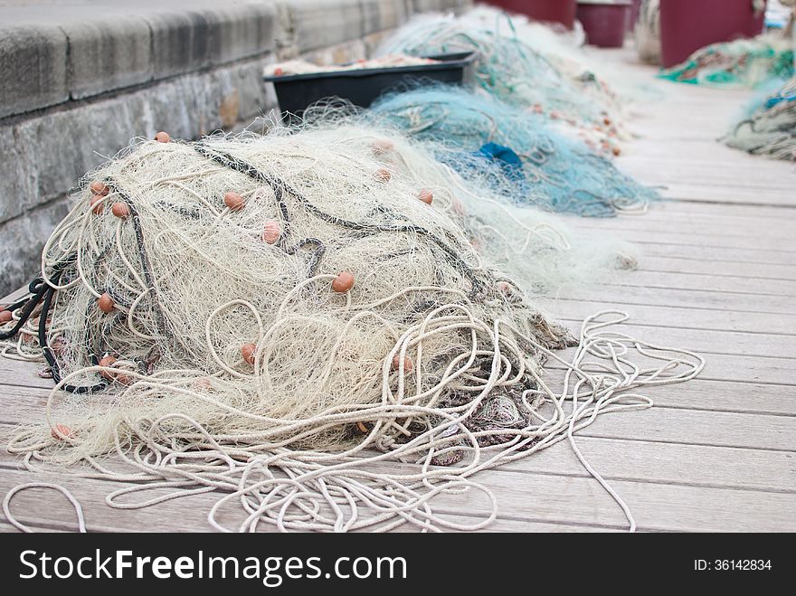 Fishing net laying on the ground in port of Prian - Slovenia