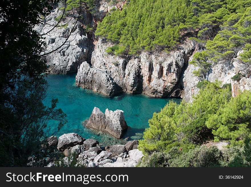 Rocky bay with green mediterranean vegetation