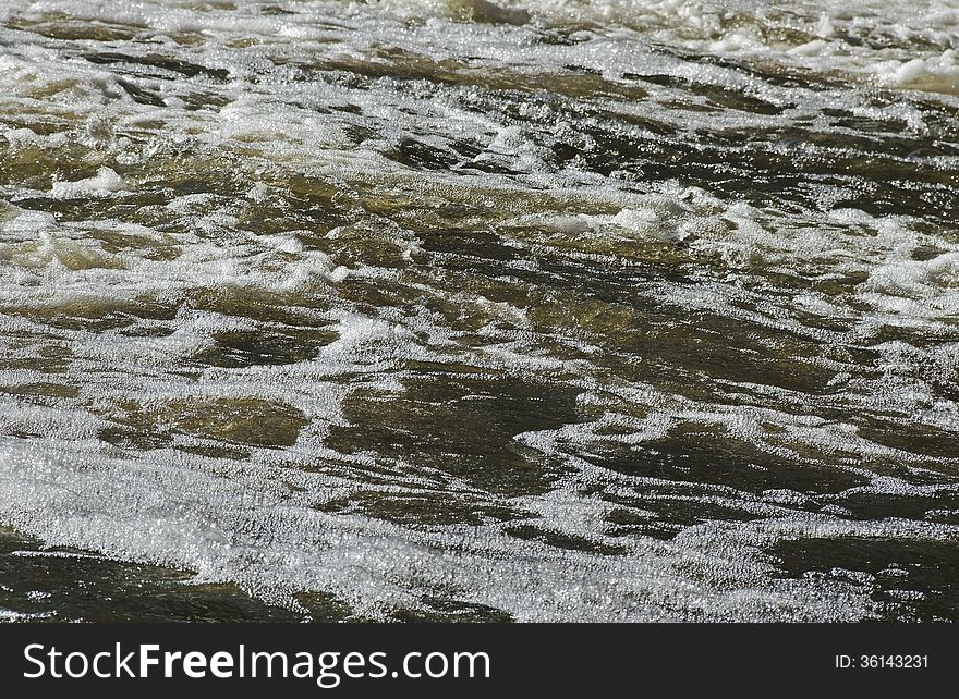 Small rapid river in winter season. Small rapid river in winter season.